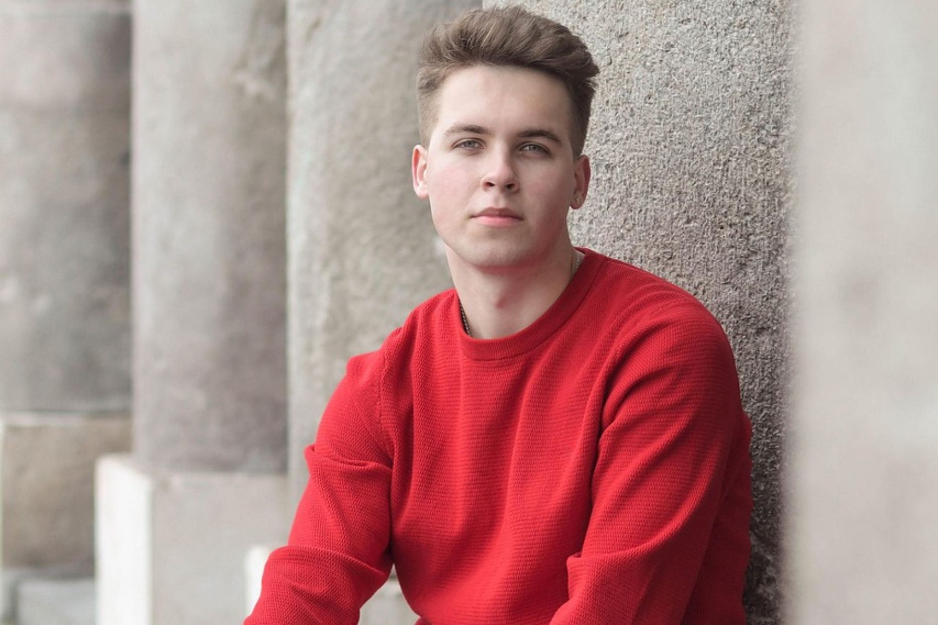 Young man wearing a red sweater